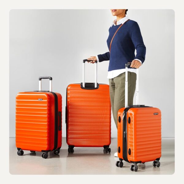 Amazon Basics 3-Piece Set (21", 26", 30"), Hardshell Suitcases With Wheels, Expandable For Up to 25% More Space, With Scratch-Resistant Surface, Four Multi-directional Wheels, Orange - Image 3